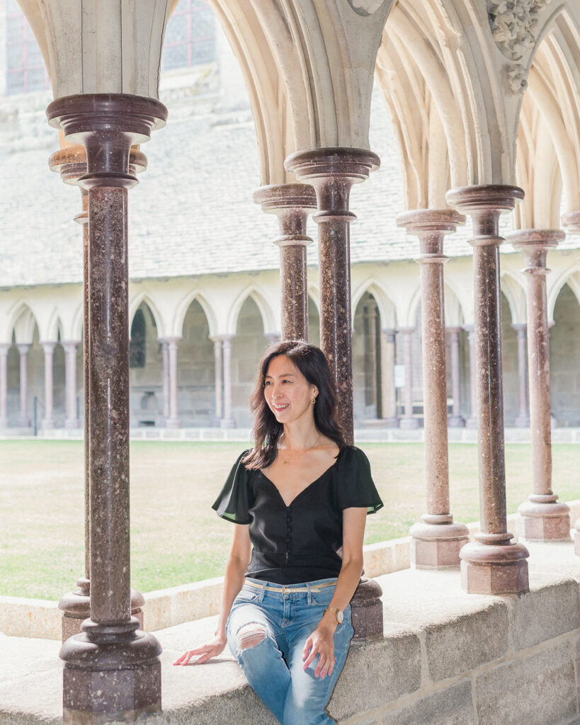 Girl Admiring the Mont St Michel Abbey Courtyard