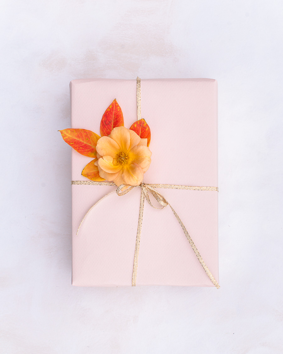 Gift wrapped with flower and leaves