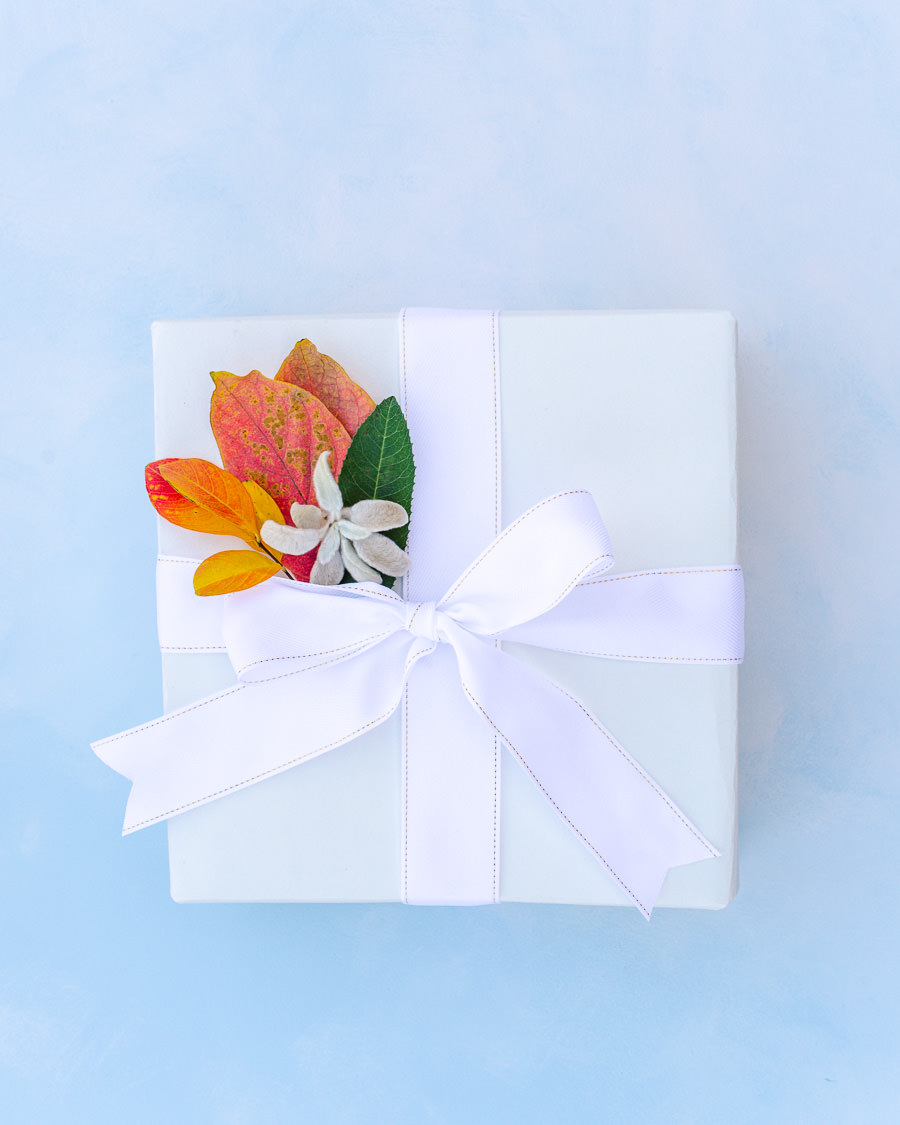 Gift wrapped with recyclable paper and decorated with colorful leaves