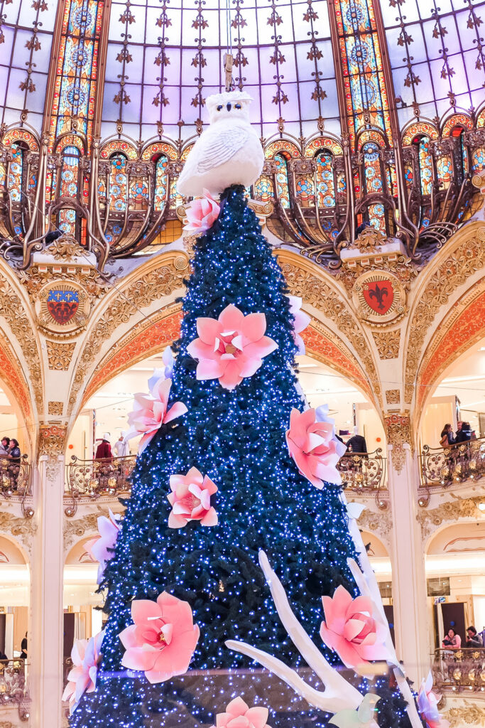 Christmas tree and decorations inside Galeries Lafayette in Paris