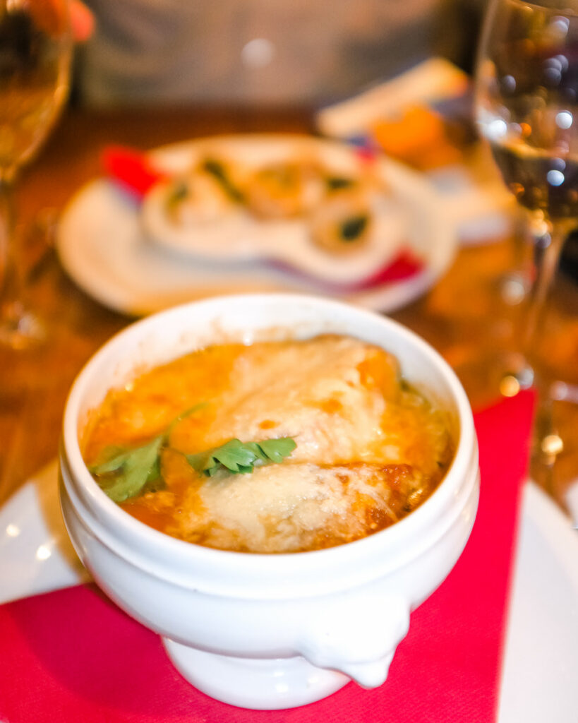 Seasonal foods such as French Onion Soup - The Best Things About Christmas in Paris France