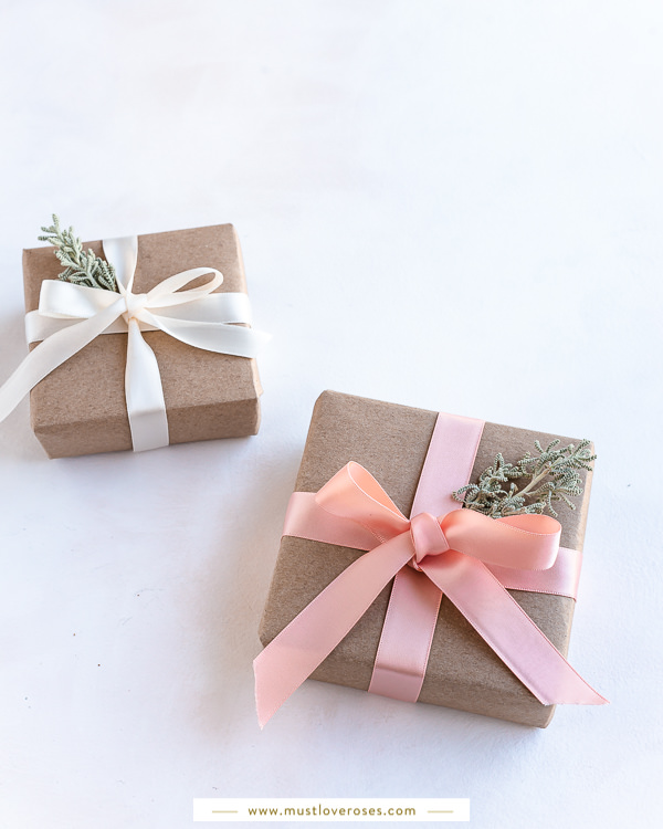 Gifts wrapped with eco-friendly kraft paper, ribbons and flowers